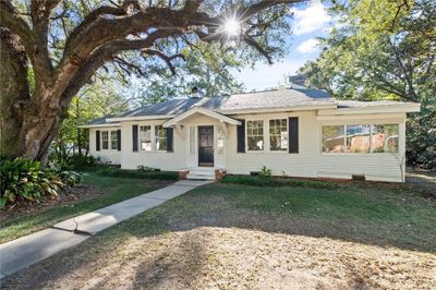 Ranch-style home with a front lawn | Image 1