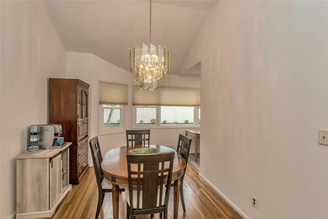 Formal Dining Room with Gleaming Hardwood Floors | Image 8