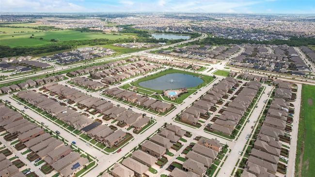 Aerial view of property and surrounding area featuring nearby suburban area and a large body of water | Image 36