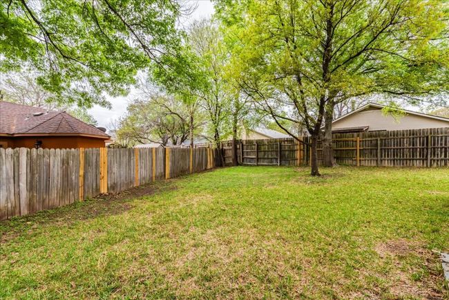View of yard with a fenced backyard | Image 22