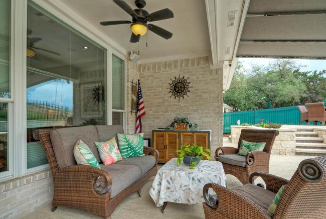 View of patio / terrace featuring fence and ceiling fan | Image 31