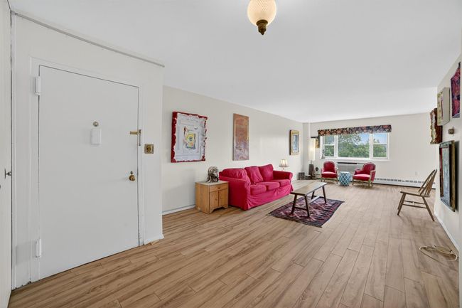 Living area with light wood finished floors | Image 7