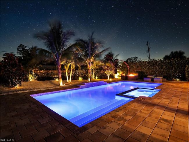View of pool with an in ground hot tub and a patio | Image 40