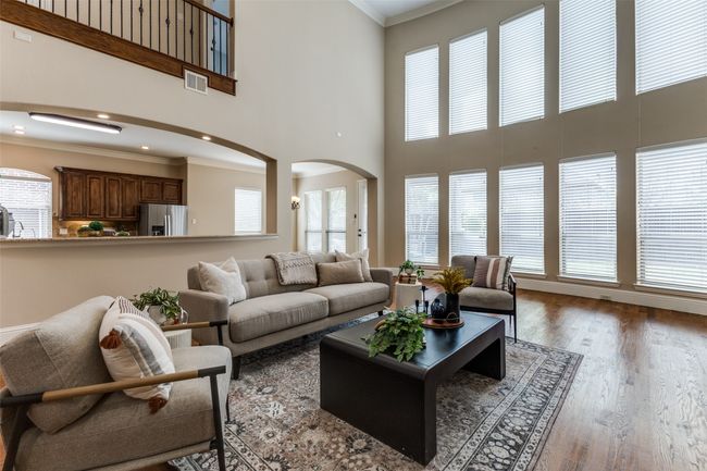 A wall of windows offers plenty of light throughout downstairs. | Image 6
