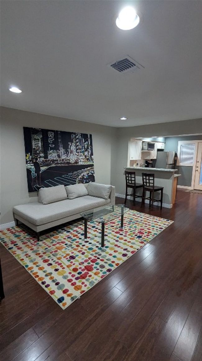 Living room featuring baseboards, dark wood-style flooring, and recessed lighting | Image 6
