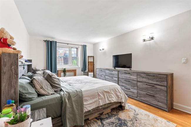 Bedroom featuring light wood-style floors | Image 11