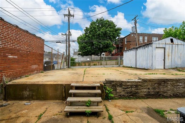 Exit back door to parking. Fully fenced. | Image 11