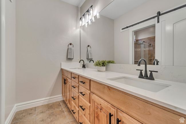 Bathroom with double vanity and a stall shower | Image 24