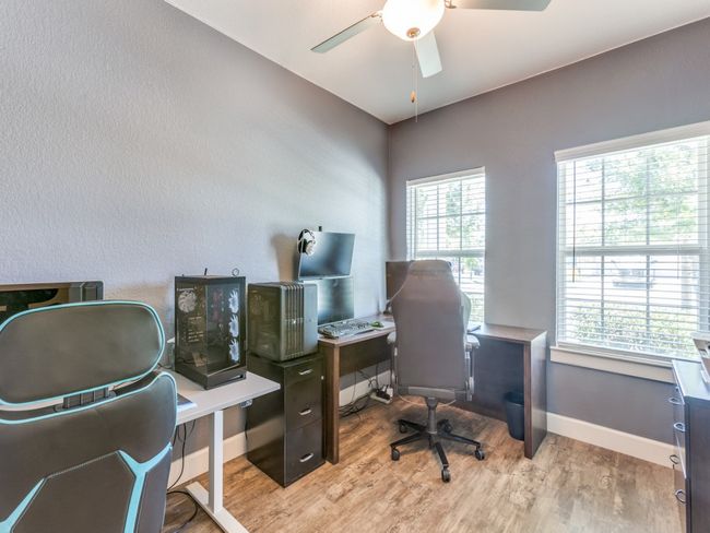 Office space featuring wood finished floors and ceiling fan | Image 17