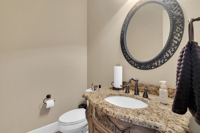 Half bathroom with toilet and vanity | Image 30