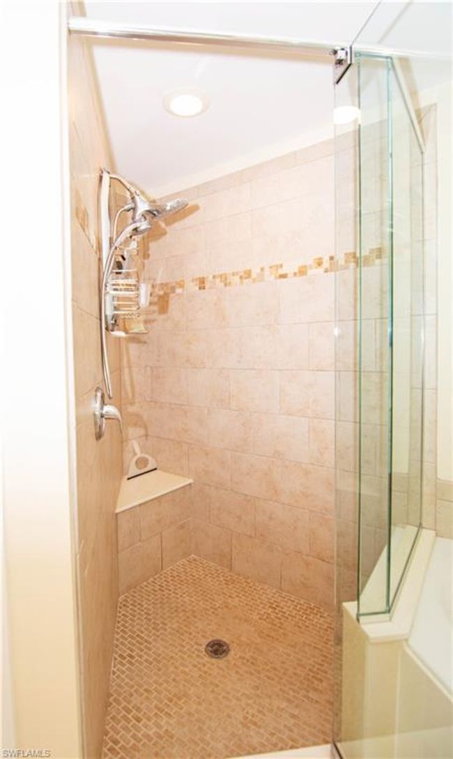 Oversized custom tiled shower in primary bathroom suite. | Image 20