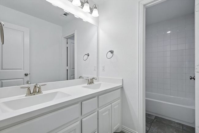 Full bathroom with double vanity and shower / bath combination | Image 27