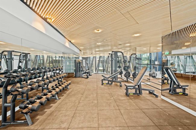 Exercise room with a wall of windows | Image 18