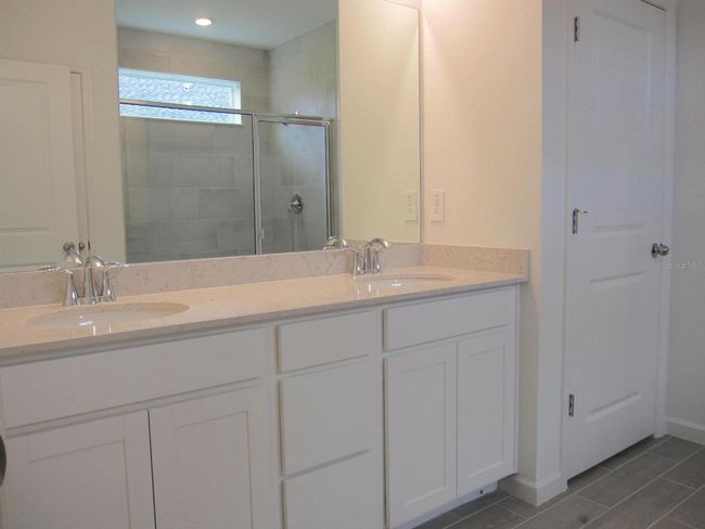 Primary bathroom dual vanity sink area | Image 22