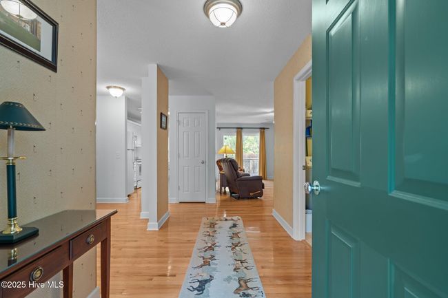 Wood floors through most of the living areas. | Image 8