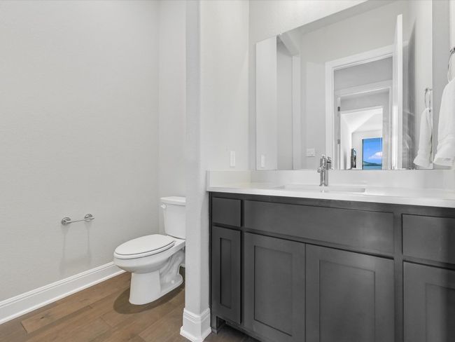Half bathroom with wood finished floors and vanity | Image 29
