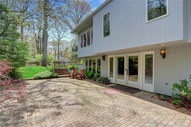 Rear view of house with fence, french doors, and a patio area | Image 37