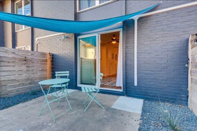 Entrance to property with brick siding and a patio | Image 7