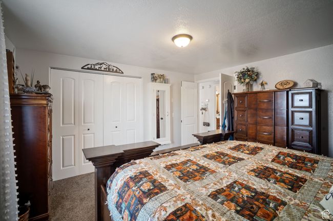 Bedroom featuring carpet floors and a closet | Image 9