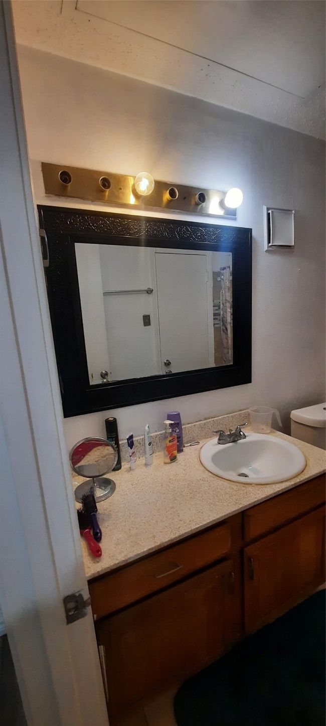Bathroom featuring vanity | Image 9