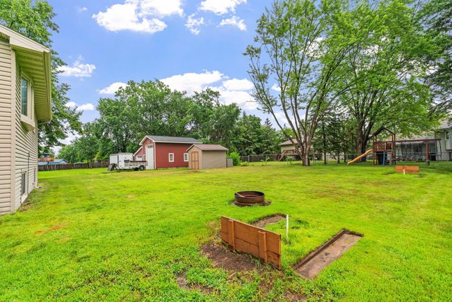 The horseshoe pit and firepit area offer great spaces for outdoor fun and entertaining! | Image 34
