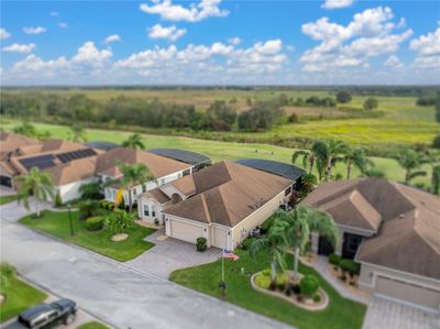 Home with golf course and open fields behind it | Image 2