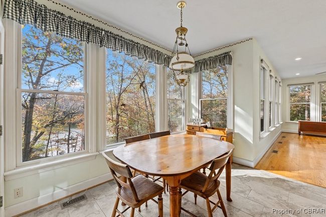 Dining room featuring recessed lighting and a chandelier | Image 24