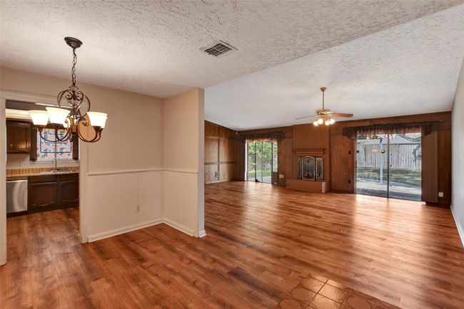 Open area for entertaining in the dining room and living room while still feeling together | Image 9