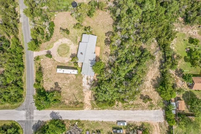 Completely private 1.338 acre lot with no HOA. The sellers own Pitter Pat Ln on the side of the home from the intersection to the fence for added privacy and ability to expand the driveway. | Image 33