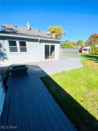 Back of property with a patio, a deck, and a lawn | Image 2