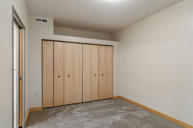 All 4 bedrooms are nicely sized and have large closets too. (The photos are of unit 401. Owned by the same person and finishes that are VERY similar) | Image 16