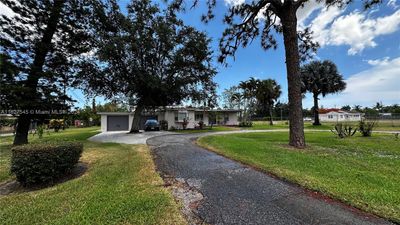 1128 Park Ln, House other with 4 bedrooms, 3 bathrooms and null parking in Haverhill FL | Image 1