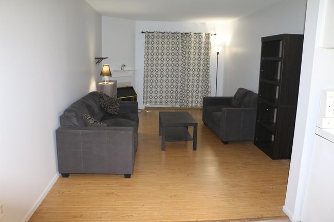 Living area with light wood-style floors | Image 10