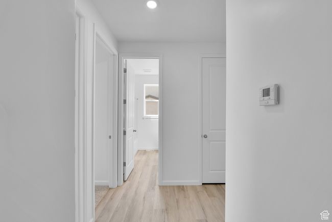 Hallway featuring light wood-style flooring and recessed lighting | Image 14
