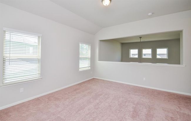 Here we are on the 2nd 'game room' floor, facing a wide wall cut out, with a view of the living area, below. | Image 20