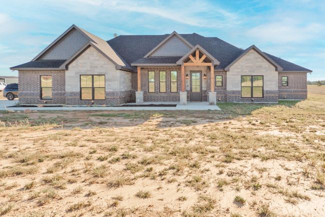 View of front facade with brick siding and stone siding | Image 36