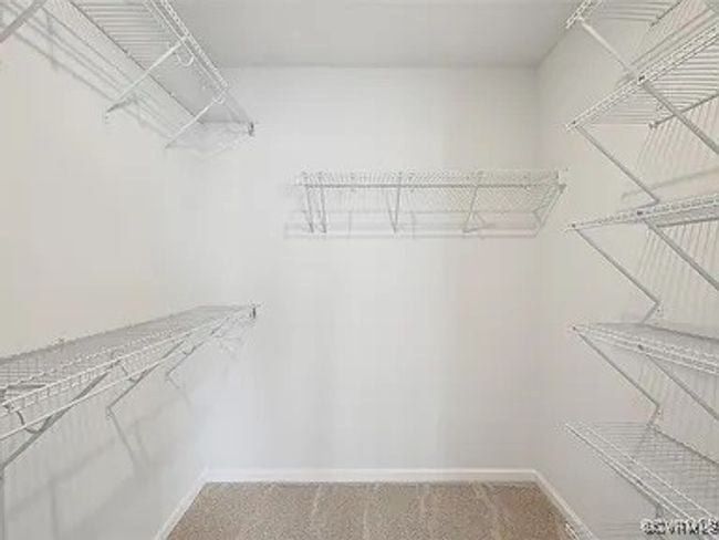 Spacious closet featuring carpet floors | Image 24