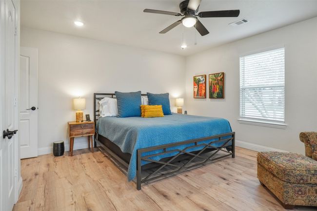 Bedroom featuring ceiling fan and light hardwood / wood-style floors | Image 15