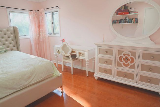 Bedroom with wood finished floors and baseboards | Image 11