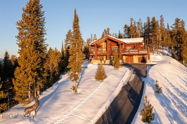 Home and private driveway with a welcoming elk statue. | Image 78