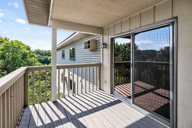 Here is an alternate view of the deck. The sliding door is Anderson brand and it was installed in 2021. | Image 20
