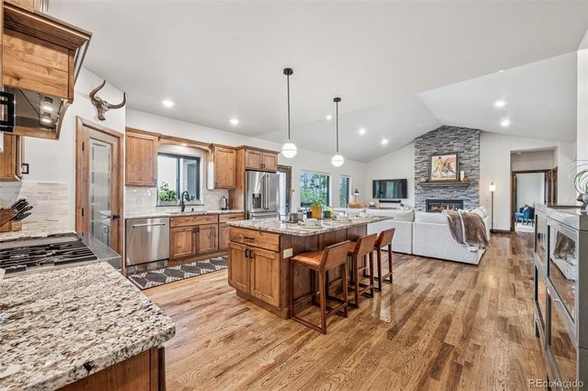 Main Level Kitchen - Gormet kitchen with island, stainless steel appliances hardwood flooring | Image 27