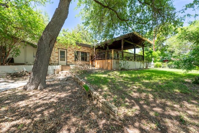 Rear view of house with a yard | Image 26