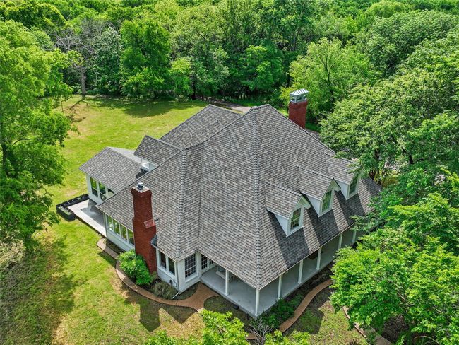 Aerial view featuring a wooded view | Image 34