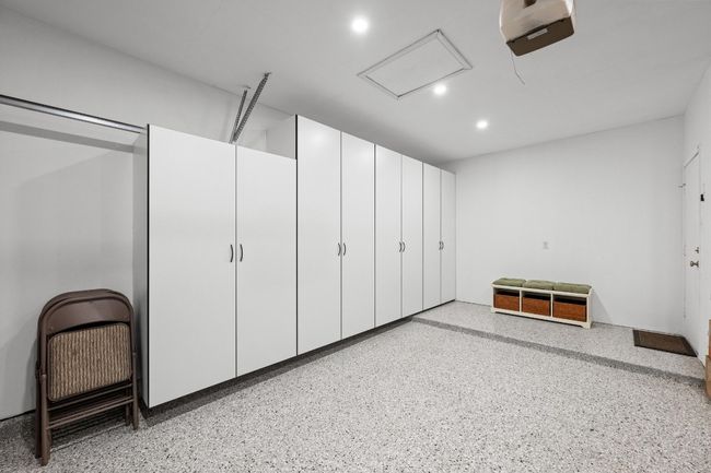 Garage with epoxy floor and cabinets | Image 31