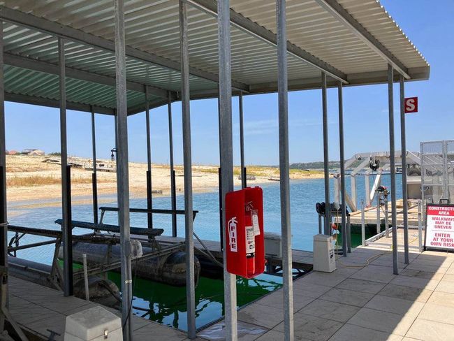Dock with a water view and boat lift | Image 7
