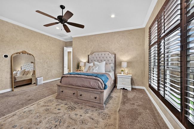 Carpeted bedroom with crown molding, a ceiling fan, and recessed lighting | Image 20
