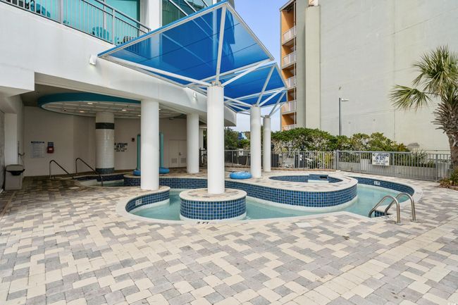 Pool featuring fence, a patio area, and a community hot tub | Image 36