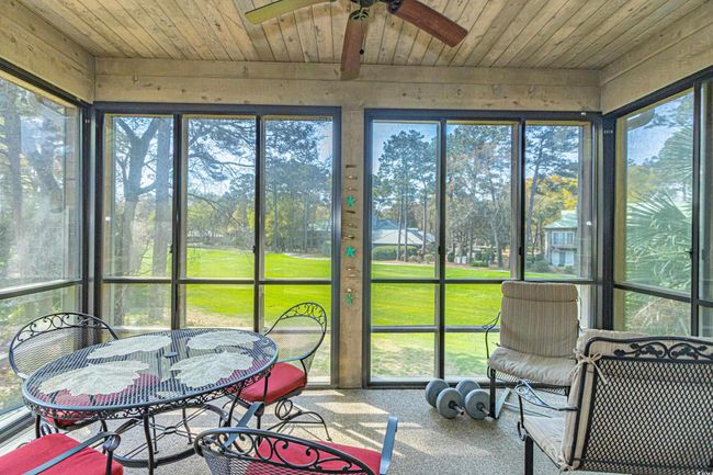 Sunroom with a ceiling fan | Image 10