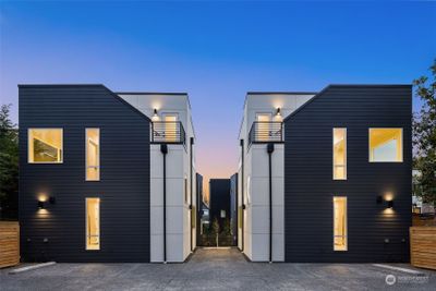 Stylish symmetry and bold lines define these twin residences, set against a breathtaking sunset backdrop. | Image 3